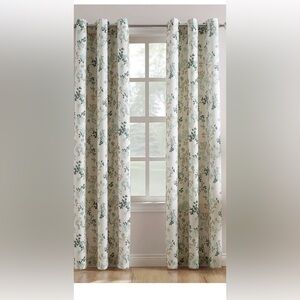 Light filtering 84Lx48w grommet drapes. Rings on drapes are bronze.